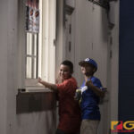 Mathew and Gavin take time out in between innings to get some snacks at the concession stand before heading back to watch their 76 Expos play ball. (Photo by Bout It Productions)