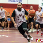 Dom Sablan runs down the court during a fast break early in the first quarter. (Photo by Michael Blas)