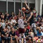 Kev Javier shoots for three as Brian Aflague contests. (Photo by Michael Blas)