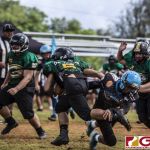 Guam Packers Jaython DeJesus gets around the defense for extra yardage. (photo by Bout It Productions)