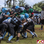 Guam Packers Jaython DeJesus finds himself surrounded by the Angels defense. (photo by Bout It Productions)