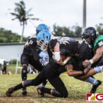 Hal's Angels Noah Medler gains yardage while protecting the pigskin from the defense. (photo by Bout It Productions)