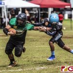 Guam Packers Eric John Sablan stiff arms an Angel defender. (photo by Bout It Productions)
