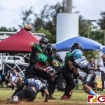 Guam Packers Austin Apatang passes the football to his receiver. (photo by Bout It Productions)