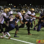 Tiyan High Titans Christopher Cowart strides through the Panthers defense. (photo by Bout It Productions)