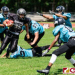 Sanchez Shark Joshua Sablan slips past two Southern defenders for positive yardage on the play. (Photo by Michael Blas)