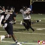 JFK Islanders Jacobe Quinata gets by the Panthers defense for extra yardage. (photo by Bout It Productions)