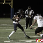 Guam High Panthers Andra Johnson looks to get by JFK Islanders Calairo Kristopher. (photo by Bout It Productions)