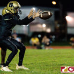 Tiyan Titan Kaekoa Leon Guerrero receives the snap late in the fourth quarter. (Photo by Michael Blas)