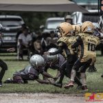 The Barrigada Crusaders offense scramble to recover the hike. (photo by Bout It Productions)