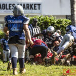 Southern Cowboys Michael
San Nicolas finds himself surrounded by the Faha Outlaws defense. (photo by Bout It Productions)