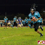 Southern Dolphin Cerilo Reyes completes the catch for a huge gain on the play. (Photo by Michael Blas)