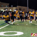 Sanchez Shark QB Jayton Penaflor pushes Panther Matua Whalen off and sprints for the first down. (Photo by Michael Blas)