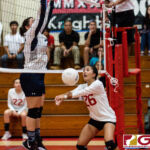 St. John's Knight Nikki Mathews bumps after a block from Harvest's Carissa McMillan. (Photo by Michael Blas)