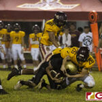 Fd Friars Colin Ada head locks Tiyan Titans Kaekoa Leon Guerrero for the takedown. (photo by Bout It Productions)