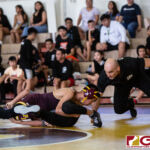 High School wrestlers hit the mats in a Preseason Tournament held at the FD Jungle. (photo by Bout It Productions.)