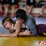 High School wrestlers hit the mats in a Preseason Tournament held at the FD Jungle. (photo by Bout It Productions.)