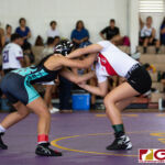 High School wrestlers hit the mats in a Preseason Tournament held at the FD Jungle. (photo by Bout It Productions.)