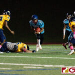 Southern Dolphin RB Conan Baza glides out of a tackle from Guam High Panther Matua Whalen. (Photo by Michael Blas)