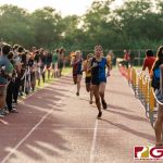 St. Paul Warrior Mikayla Criss pushes in the final stretch to finish with a time of 23:34. (Photo by Michael Blas)