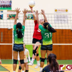 St. John's Knight Tylee Shepherd tips as Islanders Kiana Rivera and Valerie Escalona contests. (Photo by Michael Blas)