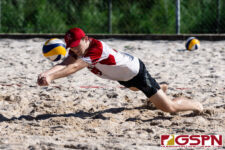 St. John's Knight Cameron Kelley dives for the ball early in the first set of the matchup. (Photo by Michael Blas)