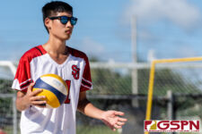 St. John's Knight Erren Chen gets ready for a serve in the first set of the matchup. (Photo by Michael Blas)