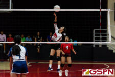 St. John's Knight Ella Wigsten gets the ball over the net in the first set of the game. (Photo by Michael Blas)