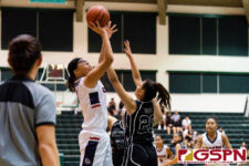 Okkodo Bulldog Angeli Dacanay takes a jump shot while Warriors Monica Giger contests. (Photo by Michael Blas)