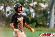 JFK Islander Allen Blend goes off after stealing home on ND catcher Kobe Martinez. (Photo by Michael Blas)