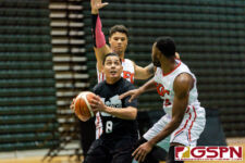 Wu Tangs Jay Casimiro looks for the bucket while being doubled by KFC Bombers Jared Glenzer and Divine Cox. (Photo by Michael Blas)
