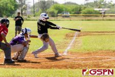 JFK Islander Malcolm Pangelinan connects with the ball at bat. (Photo by Michael Blas)