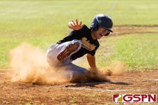JFK Islander Gavin Lim slides home to get his team on the scoreboard. (Photo by Michael Blas)