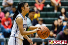 Academy Cougar Maria Taitano carries the rock down court in the second half of the game. (Photo by Michael Blas)