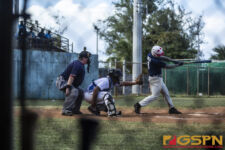 Team Guam's Cj Borja connects at bat but eventually gets out after the swing. ( photo by Bout It Productions )