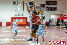 St. John's Knight Adam Cruz drives to the basket early in the first quarter. (Photo by Michael Blas)