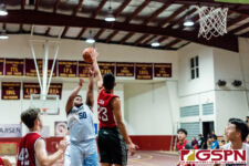 St. Paul Warrior Mack Dois fires for two while St. John's Knight Erren Chen contests. (Photo by Michael Blas)