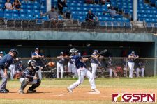 Guam's Elijah Asuncion connects with the ball at bat. (Photo by Michael Blas)