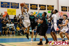 Guam High Panther Damien Dela Cruz grabs the offensive rebound and takes a shot at the basket. (Photo by Michael Blas)