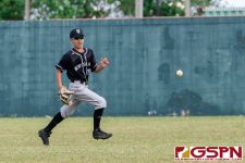 New Zealand's Brooklyn Te Kawa chases down the ball in the outfield. (Photo by Michael Blas)