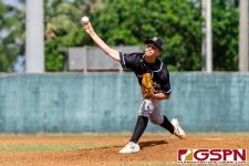 New Zealand's Blak Bailow on his first pitch in the third inning. (Photo by Michael Blas)