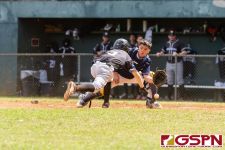 Guam's catcher goes for the ball as New Zealand's Zach Smith slides into home plate. (Photo by Michael Blas)