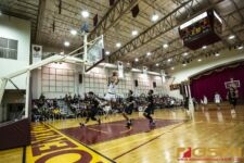 FD Friars Daryll Robles goes airborne and thrills the crowd with a spin move for the bucket. ( photo by Bout It Productions )