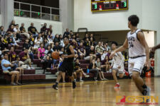 JFK Islanders Francis Borja takes the ball down court looking for an open man. ( photo by Bout It Productions )