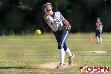 Academy Cougar Isabella Dangan releases a pitch early in the first inning. (Photo by Michael Blas)
