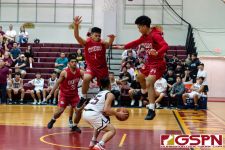 FD Friar Matthew Santos fakes out Okkodo defenders for a score. (Photo by Michael Blas)