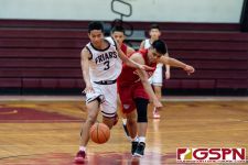 FD Friar Daryll Robles gets fouled on a fast break. (Photo by Michael Blas)