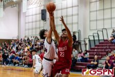 Okkodo Bulldog Rylen Cavigal gets fouled on his way to the basket. (Photo by Michael Blas)