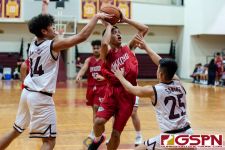 Okkodo Bulldog Kevin Cabral drives in for a shot in heavy traffic. (Photo by Michael Blas)