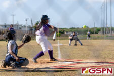 GW Gecko Andrea Ninete takes a swing at the ball in the first inning of the game. (Photo by Michael Blas)